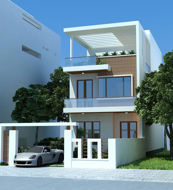Nhà ống 2 tầng 1 tum có gara để xe ngay lối vào, tiếp theo là phòng khách liên thông với phòng ăn, nhà bếp. Ảnh: Holcim.