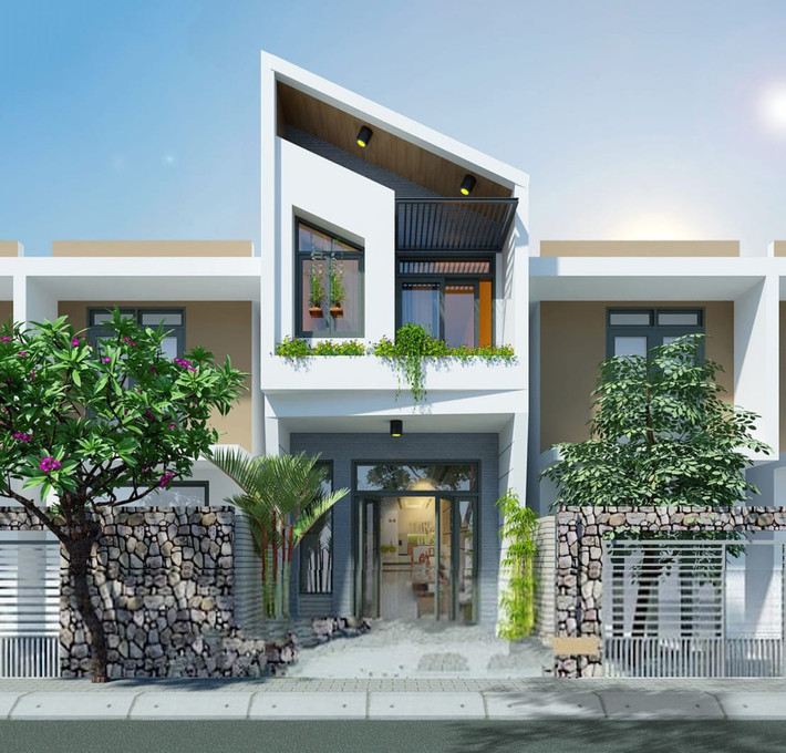 Mẫu nhà 2 tầng mái xéo sở hữu vẻ ngoài đơn giản với màu sơn trắng chủ đạo. Xen kẽ là không gian xanh với bệ hoa, chậu cây cảnh ở ban công. Ảnh: Wedo