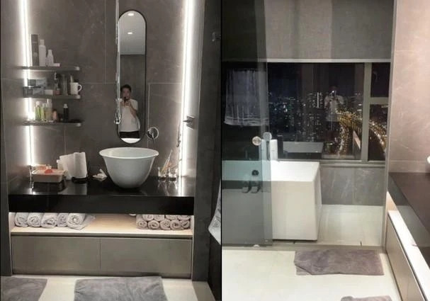 Phòng tắm mang tông xám - đen với đồ dùng hiện đại như trong khách sạn cao cấp.