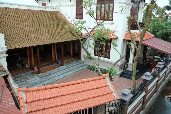 Nhà gỗ xoan 3 gian đơn giản. Ảnh: Goduccuong.