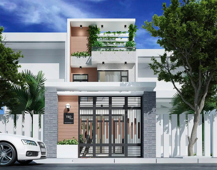 Mẫu nhà ống 3 tầng đơn giản nhưng nổi bật nhờ thiết kế tầng thượng xanh cùng tường ốp sàn gỗ khá lạ mắt. Ảnh: Wedo.