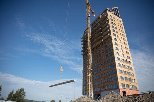 Để giữ cho tòa tháp đứng vững trong gió, các tầng trên được xây bằng bê tông. Ảnh: Archinect.