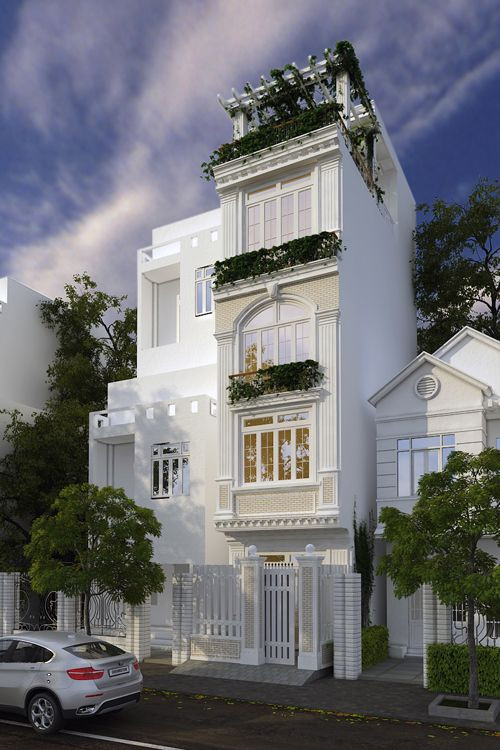 Nhà ống tân cổ điển sử dụng gam màu trắng sáng kết hợp họa tiết tinh tế. Ảnh: Xaynhasaigon.