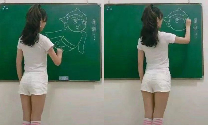 Một cô giáo diện quần short ngắn đứng bảng.
