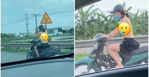 Nếu xem kĩ đoạn clip, ngoài việc ăn mặc trang phục phản cảm, cô gái trên còn có màn thả tay khi điều khiến xe máy cực kì nguy hiểm.
