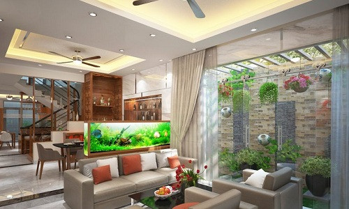 Để tạo không gian thoáng, sang trọng, nhóm kiến trúc sư Song Phát Construction đã kết hợp trần nhà cao với các khung cửa sổ kính.