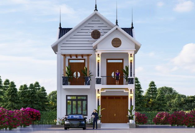 Nhà 2 tầng mái thái có tính năng tản nhiệt chống nóng tốt. Mặt tiền ngôi nhà được thiết bậc tam cấp dẫn vào cửa chính trang trọng. Ảnh: Wedo.