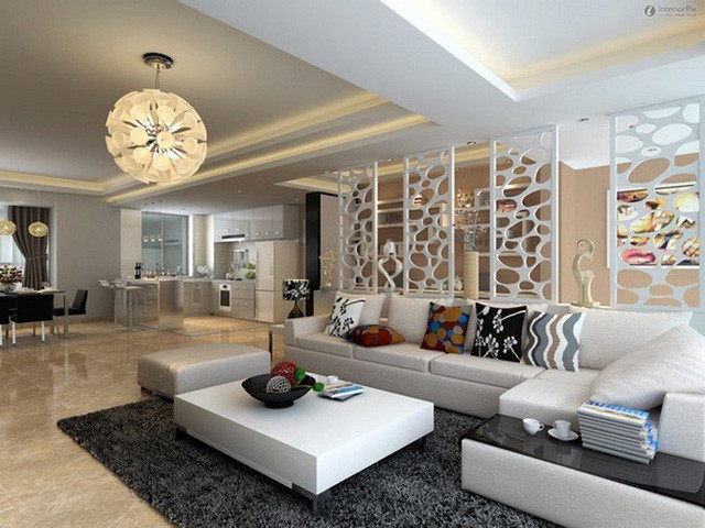 Vách ngăn kết hợp với tủ để đồ tạo thành chỗ dựa cho sofa và tạo ra lối lưu thông trong nhà.