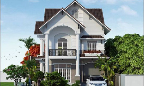 Nhà mái thái 2 tầng có phòng để xe riêng biệt thể hiện phong cách hiện đại. Không gian bên ngoài được bày trí cây xanh mát mẻ, cho gia chủ cảm giác hòa nhập với thiên nhiên. Ảnh: Nhabinhduong.
