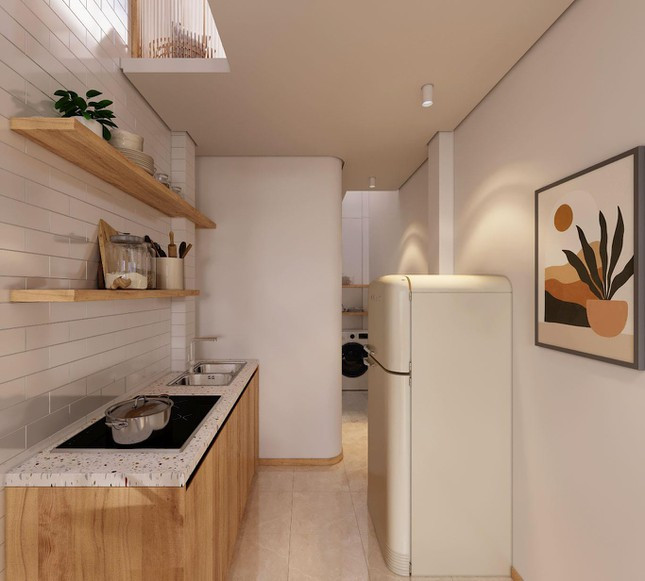 Khu vực bếp được tịnh tiến và nối dài thêm phía trước gần với cầu thang, một phần vừa lấy sáng cũng như là để mùi đồ ăn có thể được đưa ra ngoài nhanh hơn.