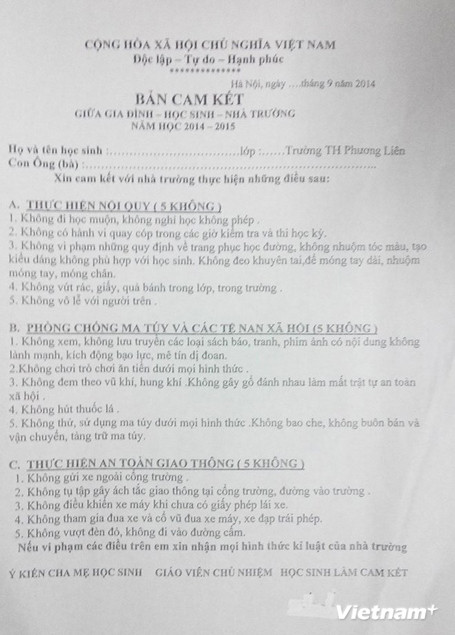 Bản cam kết của Trường Tiểu học Phương Liên gửi học sinh, phụ huynh. (Ảnh: PV/Vietnam+)