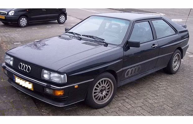 Ur-Quattro: Năm sản xuất 1980. Quattro là biểu tượng nhận diện của Audi. Hãng xe này tự định dạng mình là một công ty sản xuất xe thể thao. Do đó các mẫu xe do Audi sản xuất cũng hoàn chỉnh về mặt động cơ và hệ dẫn động 4 bánh.