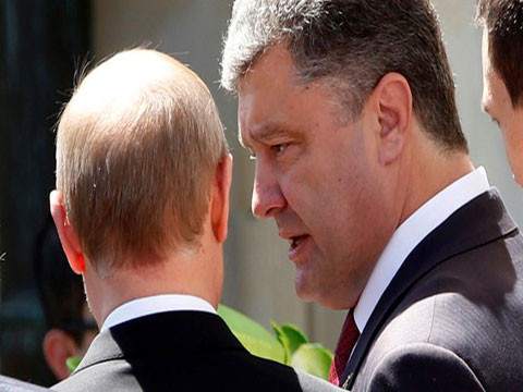 Tổng thống Nga Vladimir Putin (trái) và Tổng thống đắc cử của Ukraine Petro Poroshenko