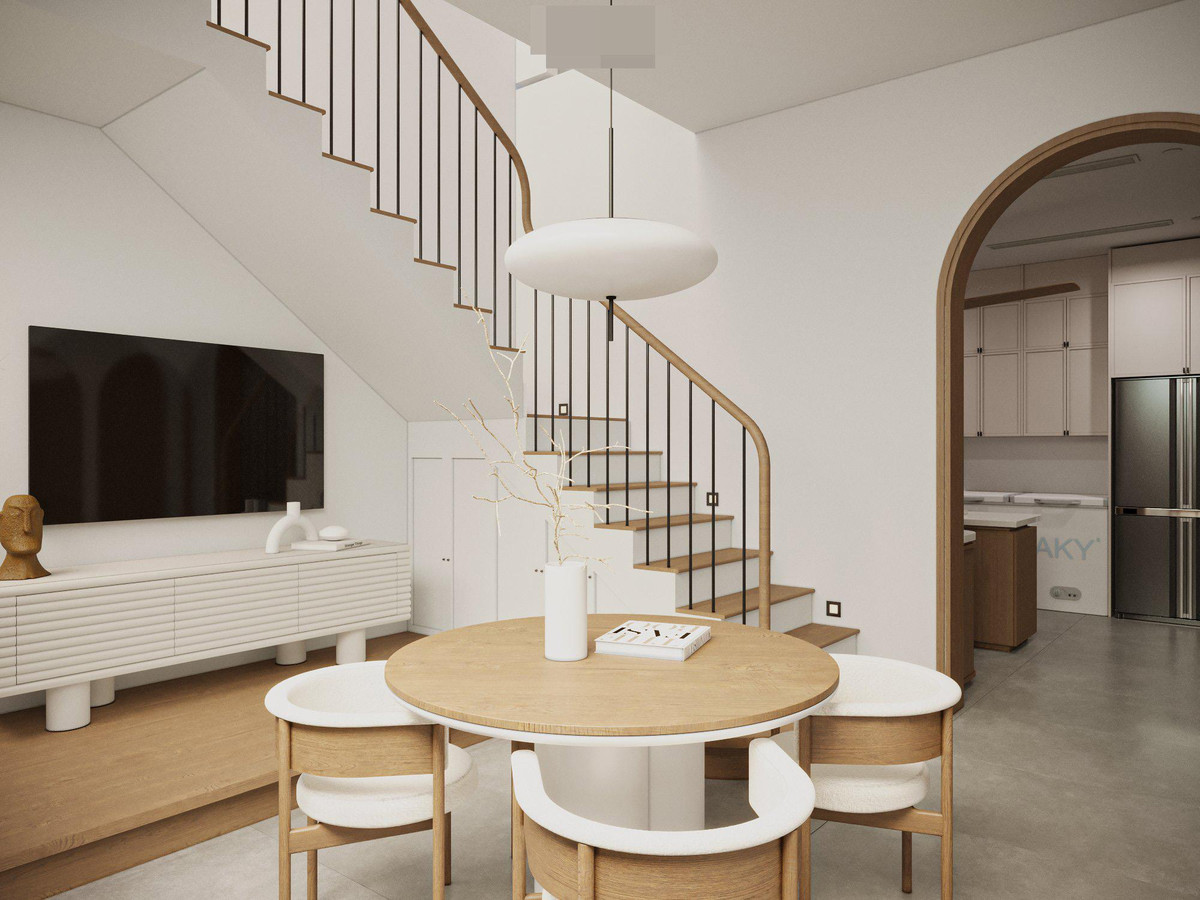 Nhờ cách bố trí hợp lý cộng với khung cửa kính lớn nên ánh sáng được cài cắm, đan xen khắp các ngóc ngách, tổng thể biệt thự không bị khô cứng mà vẫn hài hòa. Nhóm thiết kế dành một khu rộng làm bàn ăn, mở ra khoảng đệm bên hông nhà.