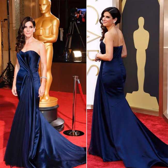 Ngôi sao Hollywood Sandra Bullock xinh đẹp, kiêu kỳ trong chiếc váy màu xanh navy của Alexander McQueen tới dự lễ trao giải Oscar 2014.