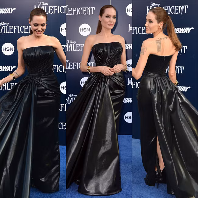 Angelina Jolie trông bớt gày gò hơn khi cô mặc chiếc váy da của Atelier Versace đi dự buổi công chiếu phim "Maleficent".