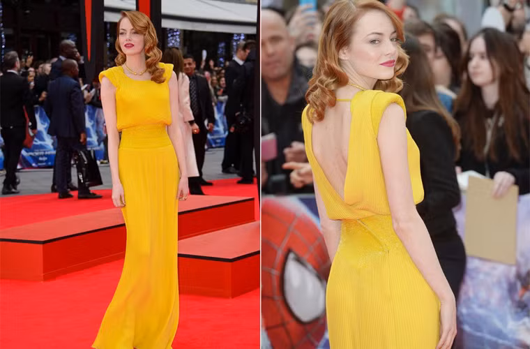 Emma Stone nổi bật với chiếc váy vàng hiệu Versace trong buổi công chiếu "The Amazing Spider-Man 2". Chiếc váy vàng, đôi môi đỏ và làn da trắng muốt khiến Emma nhận được rất nhiều lời khen.