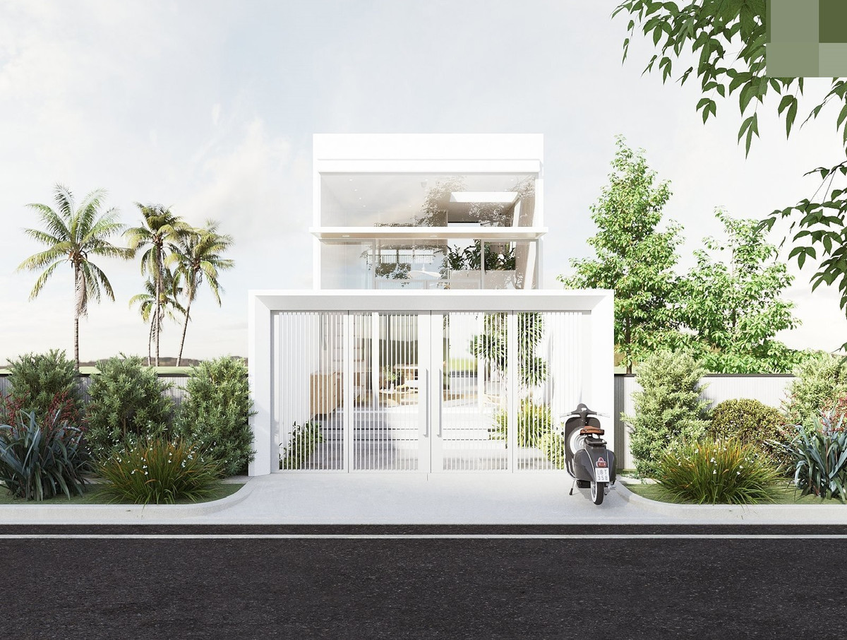 Ngôi nhà cấp 4 có gác lửng với mặt tiền đơn giản, sơn màu trắng. Cổng sắt 4 cánh rộng, lan sắt thông thoáng nhưng vẫn đảm bảo sự riêng tư cho không gian phía trong.