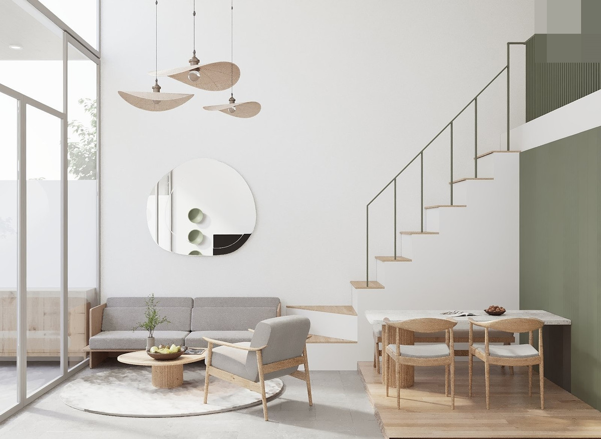 Không gian phòng khách, phía sau là bếp và phòng ngủ master. Kiến trúc sư Trương Hoàng Phúc cho biết, khi thi công, phần cầu thang sẽ được điều chỉnh để thuận tiện cho gia chủ sử dụng hơn.