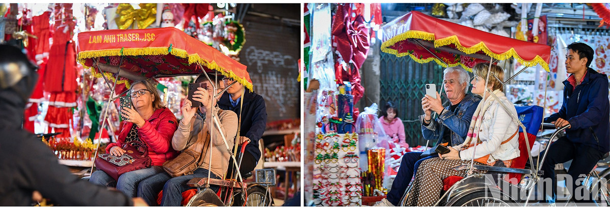 Khách du lịch nước ngoài tỏ ra thích thú với không gian lung linh sắc màu Giáng sinh khi đi tham quan trên phố Hàng Mã.