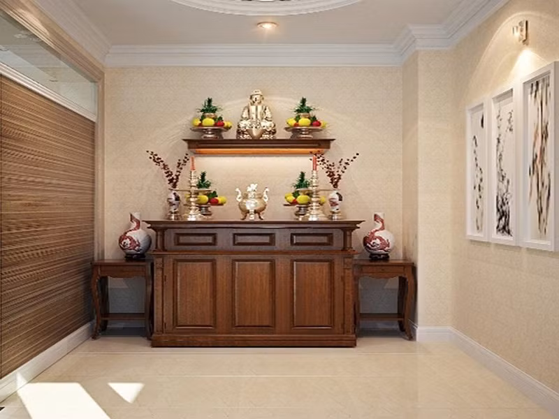  Việc để ban thờ trong phòng khách hoàn toàn có thể cân đối được bằng cách treo ban thờ lên cao ở một phía phòng khách và ở vị trí đó tránh treo đèn sáng, đèn chùm, mà chỉ cần đặt lên ban thờ đèn đỏ ánh sáng ấm áp vừa phải.