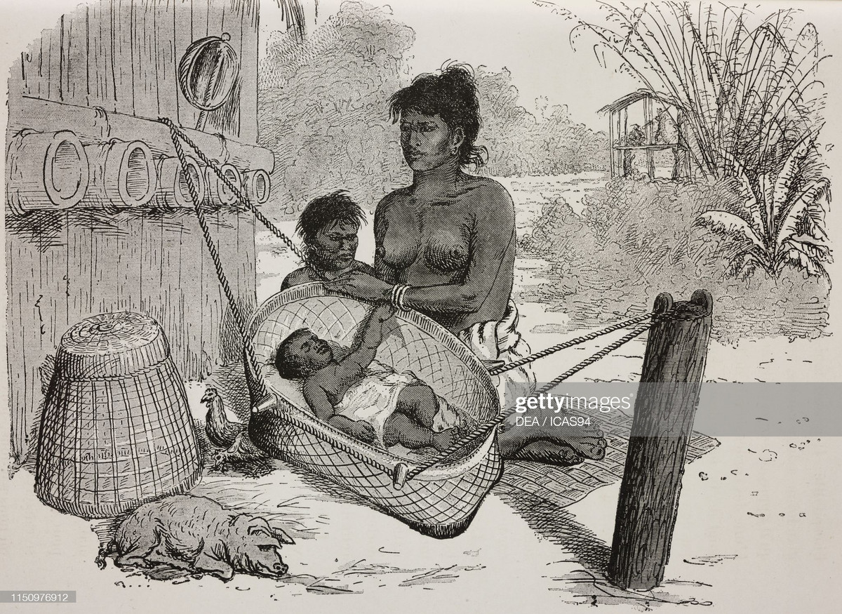 Phụ nữ dân tộc Kuy, một tộc người thiểu số ở Campuchia, bế đứa con của mình, một hình ảnh được ghi lại từ chuyến thám hiểm Campuchia.