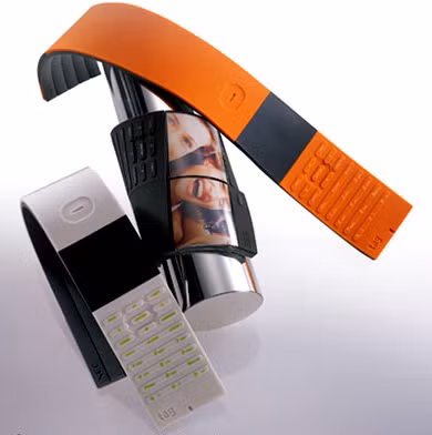 NEC Tag Phone là mẫu điện thoại mềm mại và linh hoạt, có thể quấn quanh cổ tay của người dùng. Mẫu điện thoại tương lai này có khả năng thay đổi hình dạng theo trạng thái, được thiết kế với cao su dẻo.
