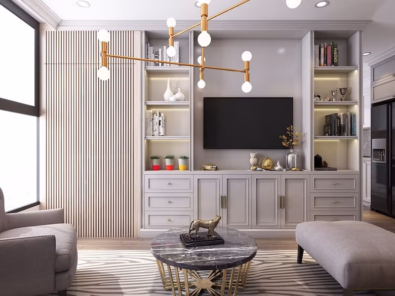 Tủ tivi kết hợp giá sách giúp phòng khách trông vẫn rộng rãi.