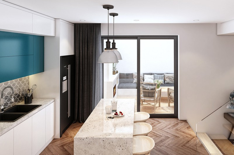 Bếp nấu đặt cạnh khoảng vườn cạnh hiên nhà, giúp mọi ngõ ngách bên trong luôn chan hòa trong ánh sáng.