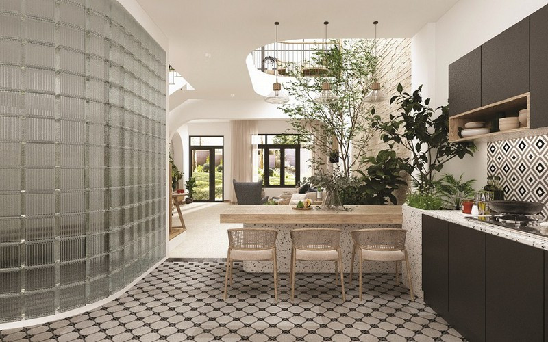 Đồ nội thất nhà bếp theo phong cách Địa Trung Hải thường mộc mạc, chất liệu được ưa chuộng thường sử dụng là gỗ và đá. Ở ngôi nhà này, các kiến trúc sư còn sử dụng thêm gạch bông trong không gian phòng bếp, tạo cảm giác nhẹ nhàng, ấm cúng mà không đơn điệu.