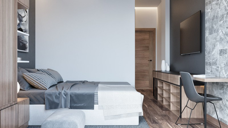 Phòng ngủ thứ 3 của cậu con trai bố trí đơn giản. Bàn học gắn liền với kệ tivi và giá sách, đặt ở cuối giường.