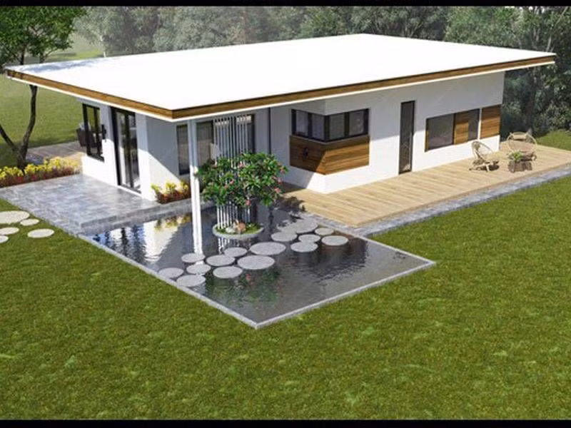 Mẫu nhà 1 tầng giá 300 triệu sử dụng tông màu trắng tinh tế, kết hợp hệ thống cửa sổ, cửa ra vào chất liệu kính khiến căn nhà trở nên hiện đại và bắt mắt. Ngoài ra, điểm nhấn độc đáo là hồ nước, tiểu cảnh trước nhà