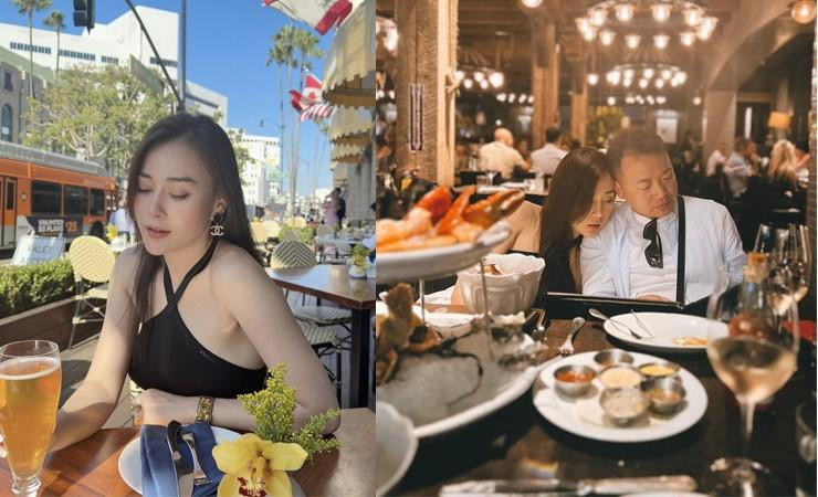 hương Oanh qua ống kính của chồng Shark Bình khi cả hai đi ăn ở một nhà hàng ngoài trời tại Mỹ.