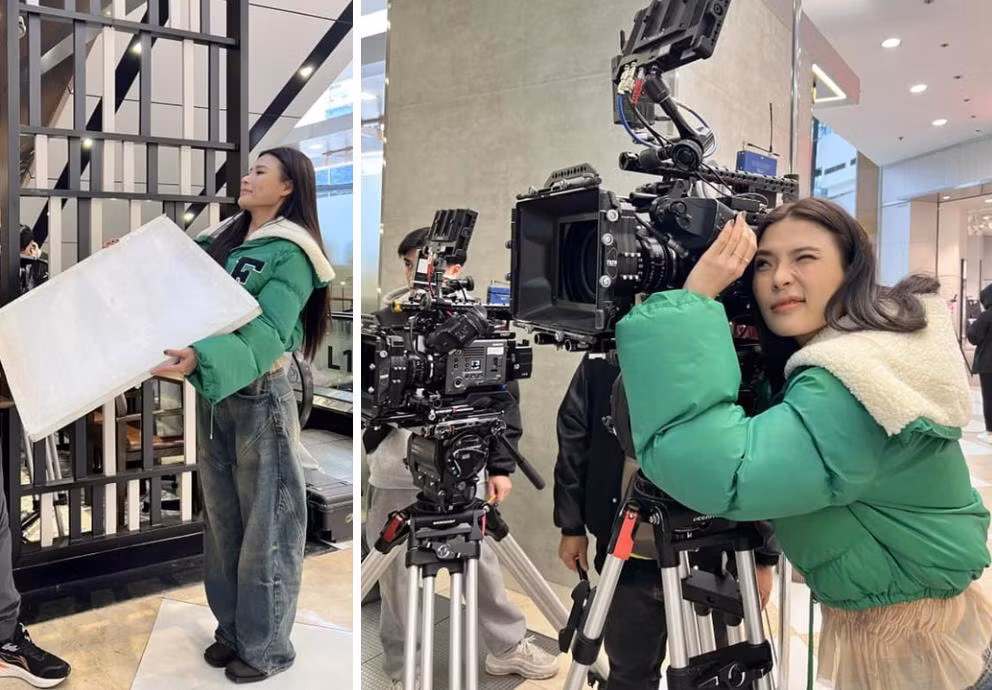 Nữ diễn viên khoe ảnh hậu trường phim với áo phao xanh lá bắt mắt.