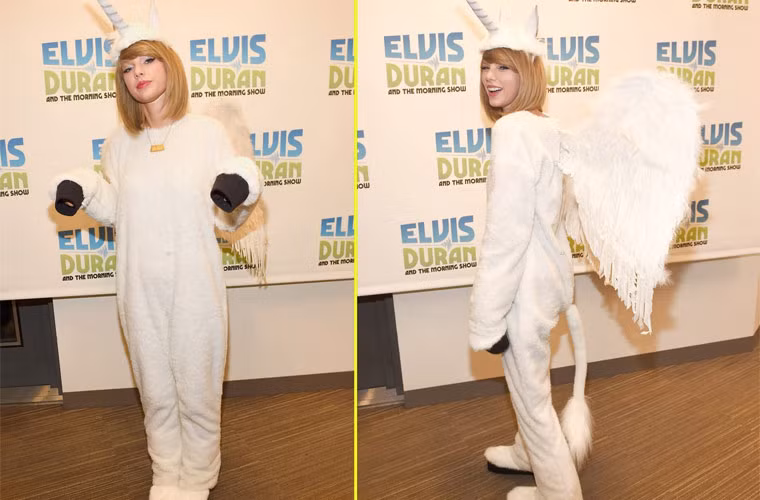 Taylor Swift đáng yêu và nhẹ nhàng với bộ trang phục Halloween màu trắng khi xuất hiện trong chương trình The Elvis Duran Z100 Morning Show đúng hôm Halloween.