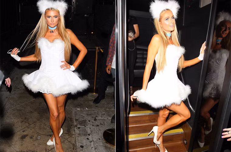Paris Hilton mặc bộ đồ trắng muốt từ trên xuống dưới y hệt như con chó cưng giá 13.000 USD mà cô mới tậu.