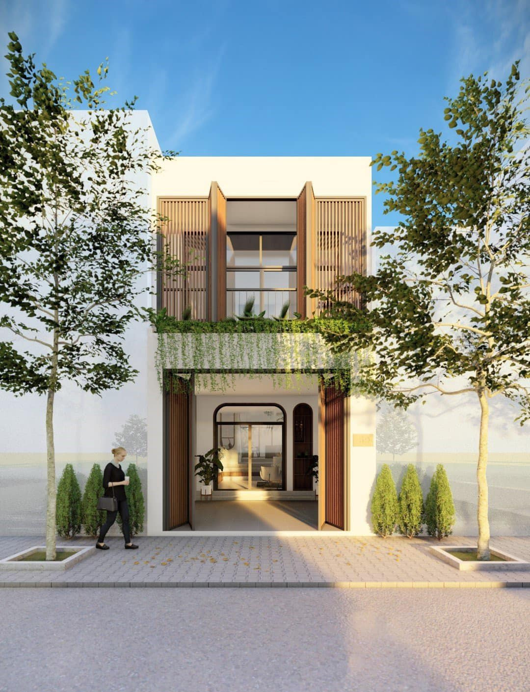 Cổng nhà bằng sắt sơn tĩnh điện với chi phí 1,5 triệu/m2, hai bên trồng cây thông nhỏ - loại cây chịu nắng, dễ trồng.