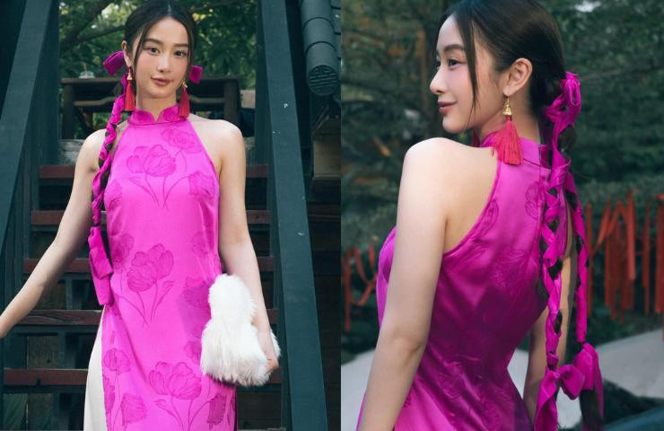 ô hoàn thiện vẻ ngoài của mình bằng cách make up nhẹ nhàng, kiểu tóc búi cao gọn gàng.