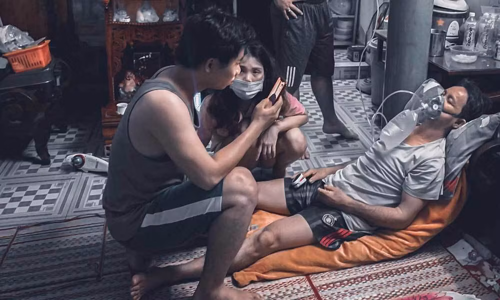 Dai gia dinh 15 F0 trong hem nho o TP.HCM chien thang COVID-19-Hinh-4