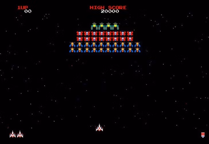 "Galaga", được biết đến ở Việt Nam với tên "Bắn ruồi", là trò chơi được hãng Bandai phát hành năm 1988. Người chơi sẽ điều khiển một con tàu vũ trị để tiêu diệt lũ "ruồi" - thực ra là các quái vật côn trùng khổng lồ đến từ hành tinh khác - để bảo vệ Trái đất.