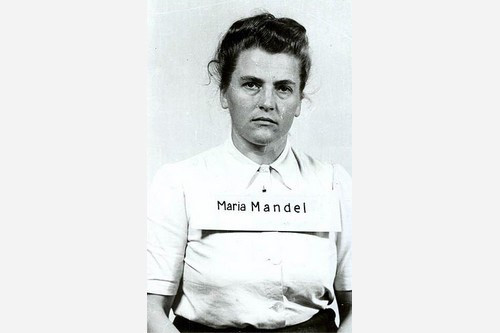 Maria Mandel được biết đến với biệt danh "Quái vật", được cho là phải chịu trách nhiệm gây ra cái chết của 500.000 tù nhân tại trại tập trung Auschwitz-Birkenau. Trước khi trở thành những nhân vật sừng sỏ nhất tại trại tập trung này, ả từng làm việc ở nhiều trại khác nhau.