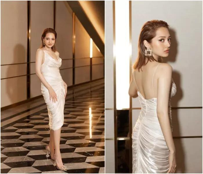 ần duy nhất nhan sắc Bảo Anh bất phân thắng bại khi "đụng hàng" các nàng hậu khác là khi cùng nhau thả dáng trong chiếc đầm trắng hai dây, chi tiết dún vải nhẹ nhàng nhưng thu hút này.