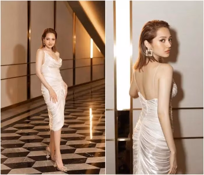 Lần duy nhất nhan sắc Bảo Anh bất phân thắng bại khi "đụng hàng" các nàng hậu khác là khi cùng nhau thả dáng trong chiếc đầm trắng hai dây, chi tiết dún vải nhẹ nhàng nhưng thu hút này.