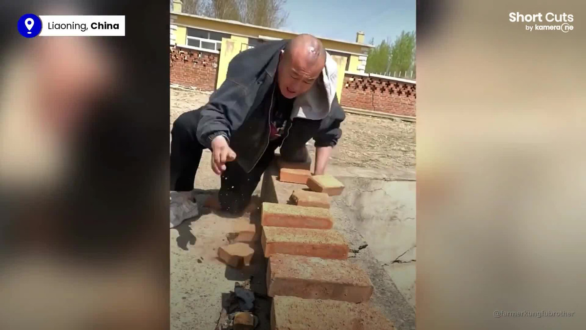 Video: Cao thu kung fu tay khong dap vo mot luc 122 vien gach