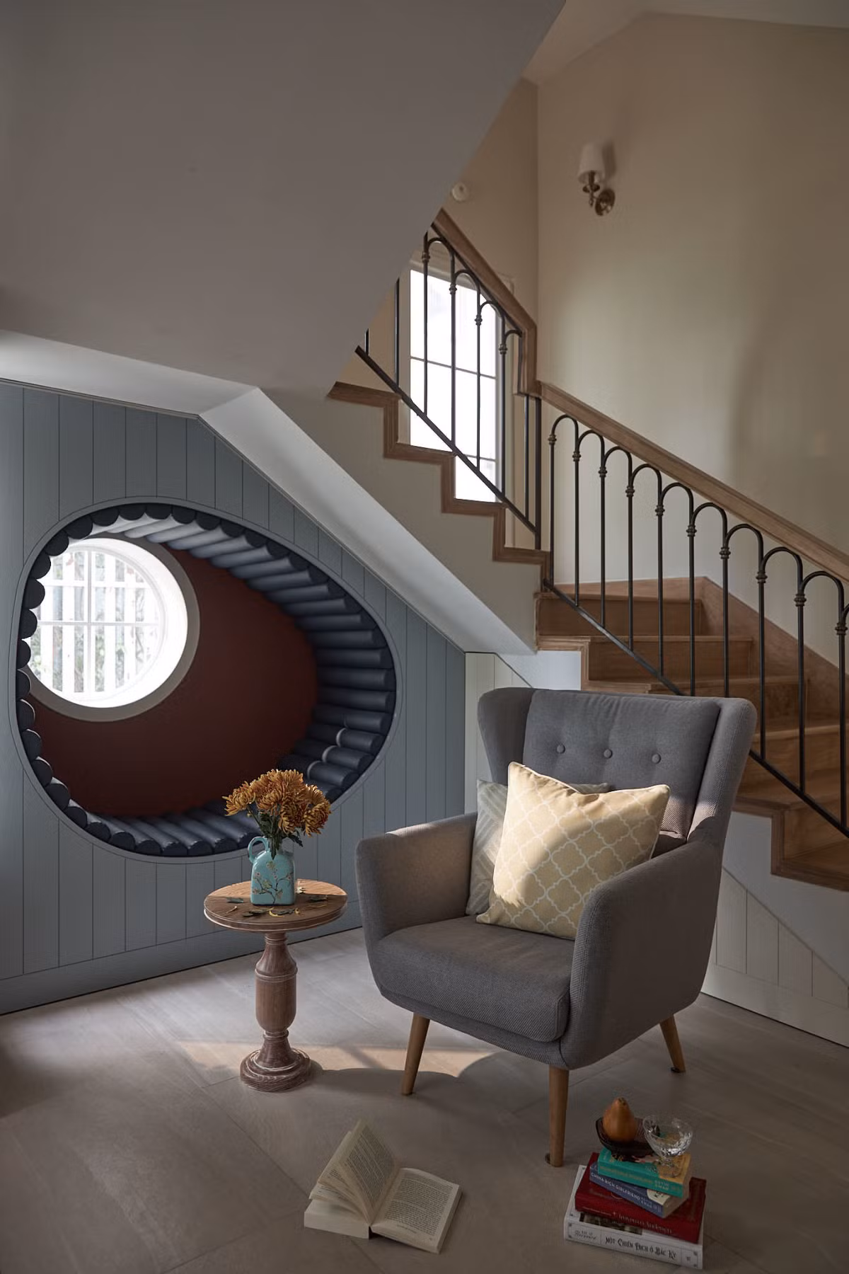 Khu vực dưới cầu thang được tận dụng làm góc đọc sách và 'chill' trà chiều của chủ nhà.