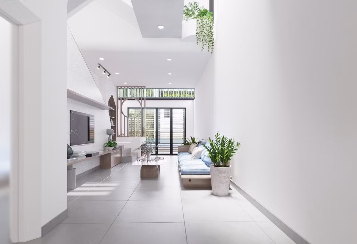 Với diện tích 4,7x20m, kiến trúc sư tạo 1 sân trước nhà đậu xe, làm vùng đệm cản nắng cho phòng khách. Cổng sắt dạng lam, kín đáo nhưng vẫn thông thoáng, không bị bí bách. Không gian bên trong dùng màu trắng làm chủ đạo, để tăng độ sáng vào ban ngày.