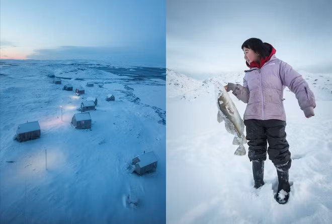 Một cô bé bắt được con cá lớn sau khi đục lỗ trên băng để bắt cá trong thời tiết lạnh giá.