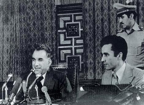 Tổng thống Amin (người ngồi trước micro) đã trở thành nạn nhân trong cuộc chơi địa chính trị giữa Mỹ-Xô những năm chiến tranh Lạnh. Tổng thống Amin (người ngồi trước micro) đã trở thành nạn nhân trong cuộc chơi địa chính trị giữa Mỹ-Xô những năm chiến tranh Lạnh.