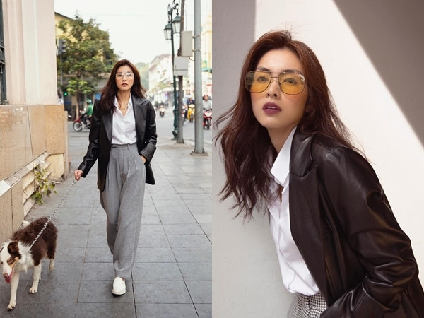 Tăng Thanh Hà dạo bước như một fashionista chính hiệu trên phố cổ Hà Nội. Sự kết hợp blazer chất da lì quyền lực với sơ mi ôm dáng và quần tây ống rộng chứng tỏ khả năng nắm bắt xu hướng nhạy bén của nữ diễn viên. Phụ kiện kính mắt màu trà cùng son môi tím trầm nhấn nhá cho đường nét gương mặt sắc sảo của Hà Tăng.