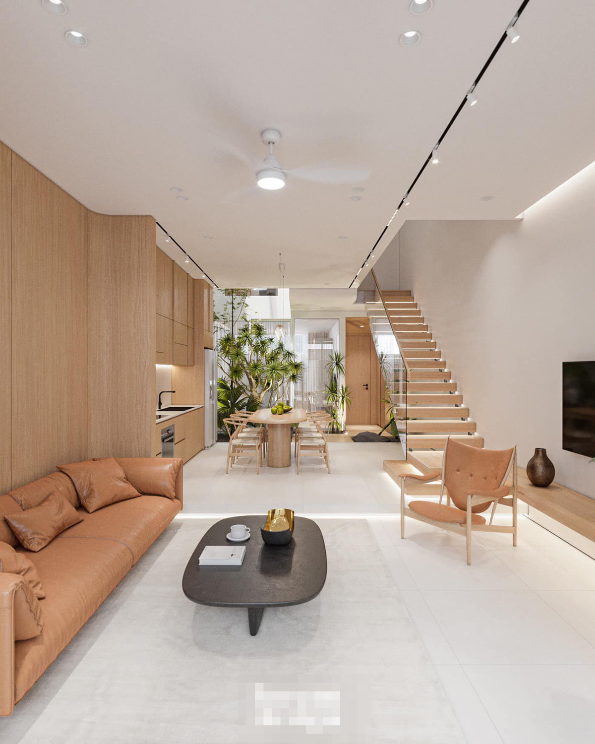 Phòng khách tối giản với bộ sofa kiểu Hàn Quốc. Tiếp nối là bếp và giếng trời, phòng ngủ cho người già và phòng vệ sinh. Cầu thang xương cá, mặt ốp gỗ mộc mạc, ấm cúng.